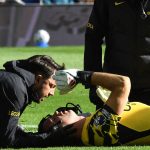 Chelsea's Argentinian goalkeeper #26 Emiliano Martinez is treated after picking up an injury during the English Premier League football match between Everton and Chelsea at Hill Dickinson Stadium in Liverpool, north west England on October 17, 2026.