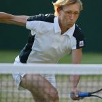 Martina Navratilova of the US hits a ball at the net as she and Leander Paes of India play their Mixed Doubles Final against Andy Ram of Israel and Anastassia Rodionova of Russia at the Wimbledon Tennis Championships 06 July, 2003 in Wimbledon, south London. Navratilova/Paes won 6-3, 6-3 and Navratilova won her 20th Wimbledon Championship title.