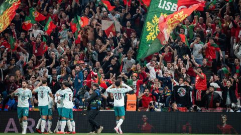 Portugal's defender #20 Joao Cancelo (R) celebrates scoring the opening goal with his teammates during the UEFA Nations League Group A4 match between Denmark and Portugal at Parken stadium in Copenhagen on October 1, 2026.