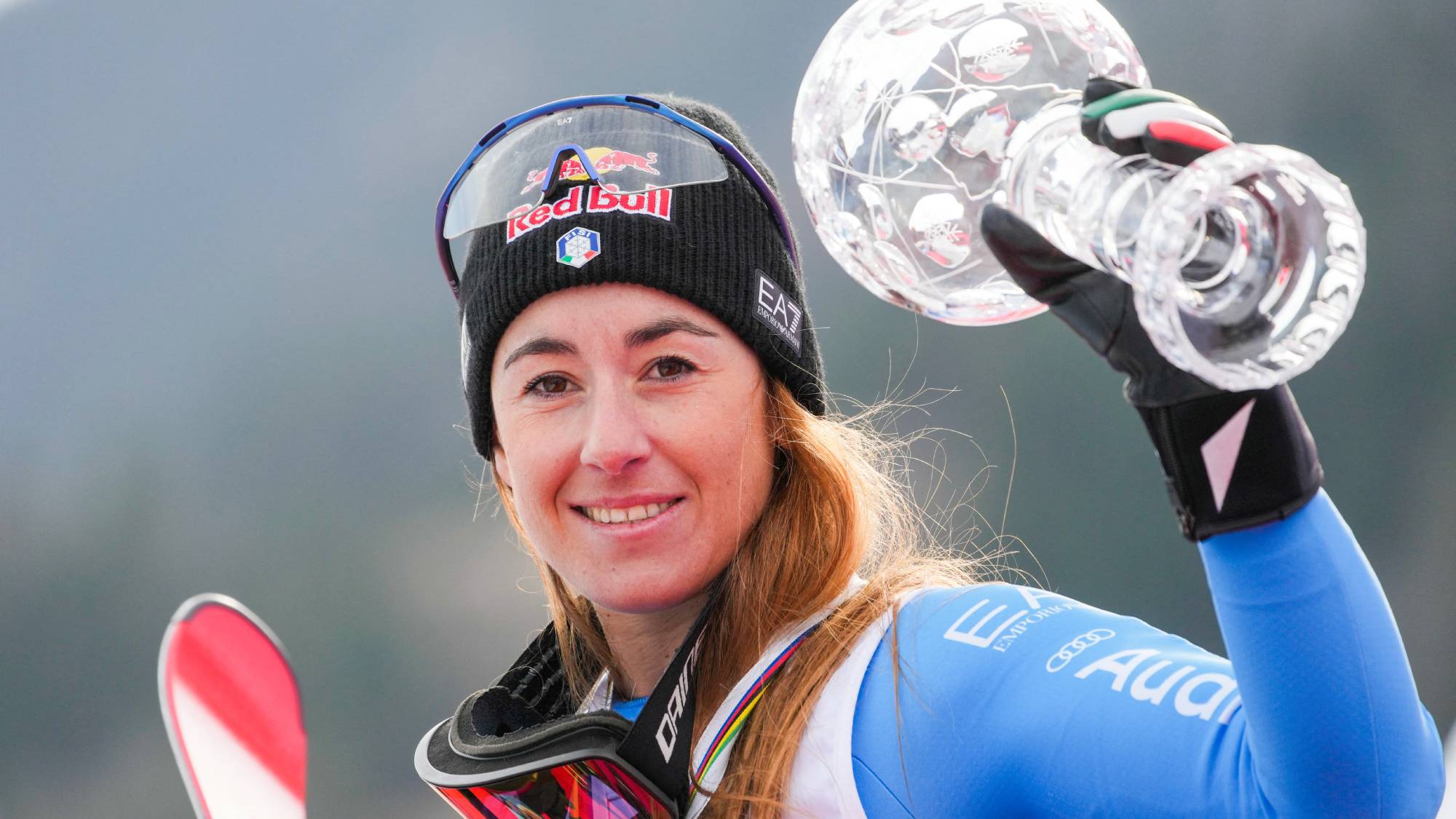 Overall winner Italy's Sofia Goggia celebrates with the Super-G overall trophy after the women's FIS Ski World Cup super-G event in Kvitfjell, near Lillehammer, Norway on March 22, 2026.