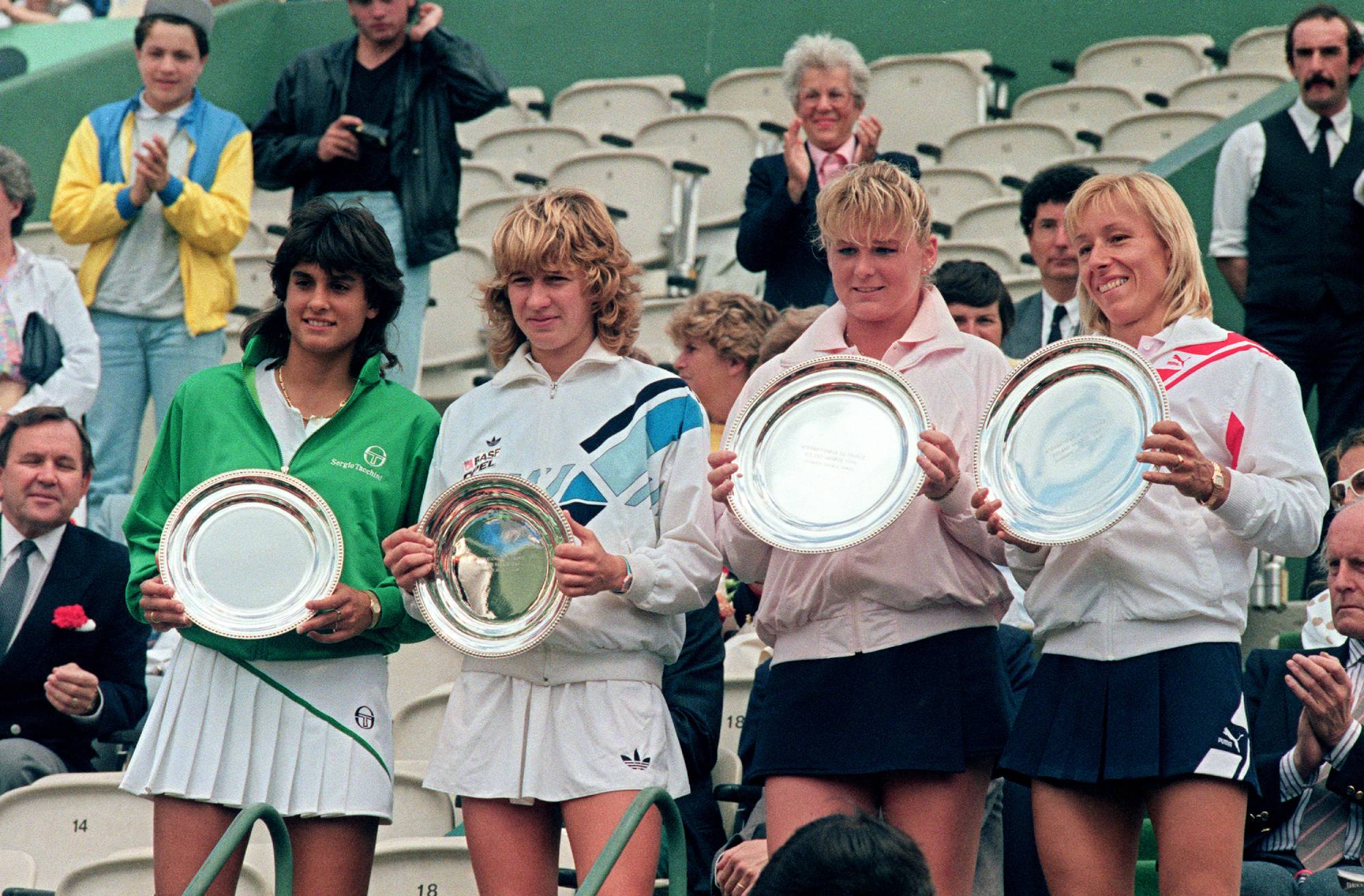Argentina's Gabriela Sabatini, German Steffi Graf, Romanian Andrea Temesvari and US Martina Navratilova (L to R) show their trophies at the end of the women doubles final of the French Open Tennis Championship in Paris 08 June 1986. Navratilova-Temesvari won the match within two sets 6-1, 6-2.