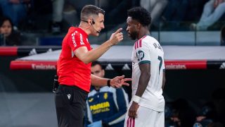 Referee Isidro Diaz de Mera Escuderos talks with Vinicius Junior of Real Madrid CF during the LaLiga EA Sports football match between Real Madrid CF and Villarreal CF at Estadio Bernabeu in Madrid, Spain, on October 10, 2026. (Photo by Alberto Gardin/NurPhoto)