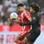 Bayern Munich's German midfielder #45 Aleksandar Pavlovic and Augsburg's French midfielder #04 Han-Noah Massengo vie for the ball during the German first division Bundesliga football match between FC Bayern Munich and FC Augsburg in Munich, southern Germany, on January 24, 2026.