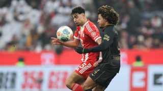 Bayern Munich's German midfielder #45 Aleksandar Pavlovic and Augsburg's French midfielder #04 Han-Noah Massengo vie for the ball during the German first division Bundesliga football match between FC Bayern Munich and FC Augsburg in Munich, southern Germany, on January 24, 2026.