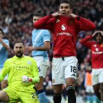 Manchester United's Brazilian midfielder #18 Casemiro (C) reacts to a missed chance as Manchester City's Italian goalkeeper #25 Gianluigi Donnarumma (L) celebrates during the English Premier League football match between Manchester United and Manchester City at Old Trafford in Manchester, north west England, on January 17, 2026.
