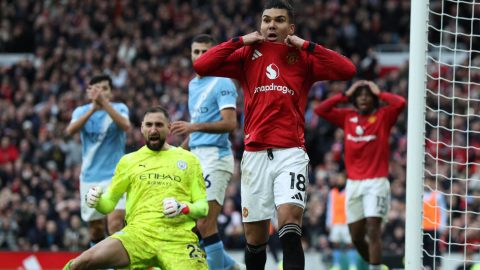 Manchester United's Brazilian midfielder #18 Casemiro (C) reacts to a missed chance as Manchester City's Italian goalkeeper #25 Gianluigi Donnarumma (L) celebrates during the English Premier League football match between Manchester United and Manchester City at Old Trafford in Manchester, north west England, on January 17, 2026.