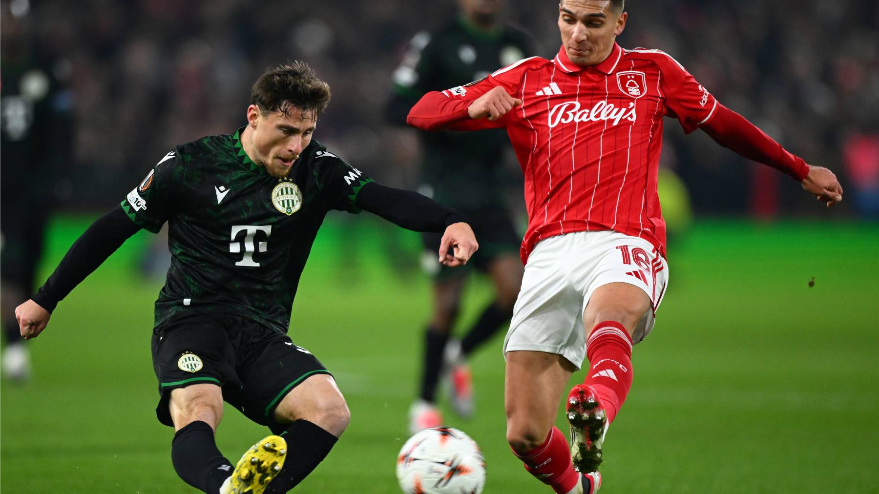NOTTINGHAM, ENGLAND - JANUARY 29: Gabi Kanichowsky of Ferencvarosi TC passes the ball whilst under pressure from Nicolas Dominguez of Nottingham Forest during the UEFA Europa League 2025/26 League Phase MD8 match between Nottingham Forest FC and Ferencvarosi TC at City Ground on January 29, 2026 in Nottingham, England. (Photo by Clive Mason/Getty Images)