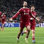 Liverpool's Hungarian midfielder #08 Dominik Szoboszlai (C) celebrates scoring his team's first goal during the UEFA Champions League, league phase day 7, football match between Olympique de Marseille (OM) and Liverpool FC at the Stade Velodrome in Marseille, southern France, on January 21, 2026.