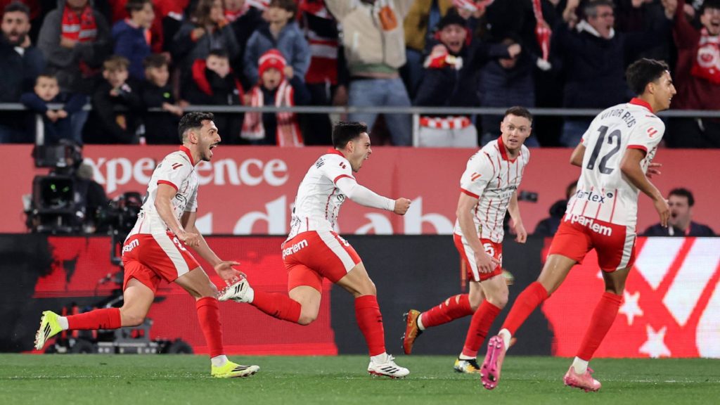 Girona's Spanish midfielder #08 Fran Beltran (C) celebrates scoring his team's second goal during the Spanish league football match between Girona FC and FC Barcelona at Montilivi Stadium in Girona on February 16, 2026.