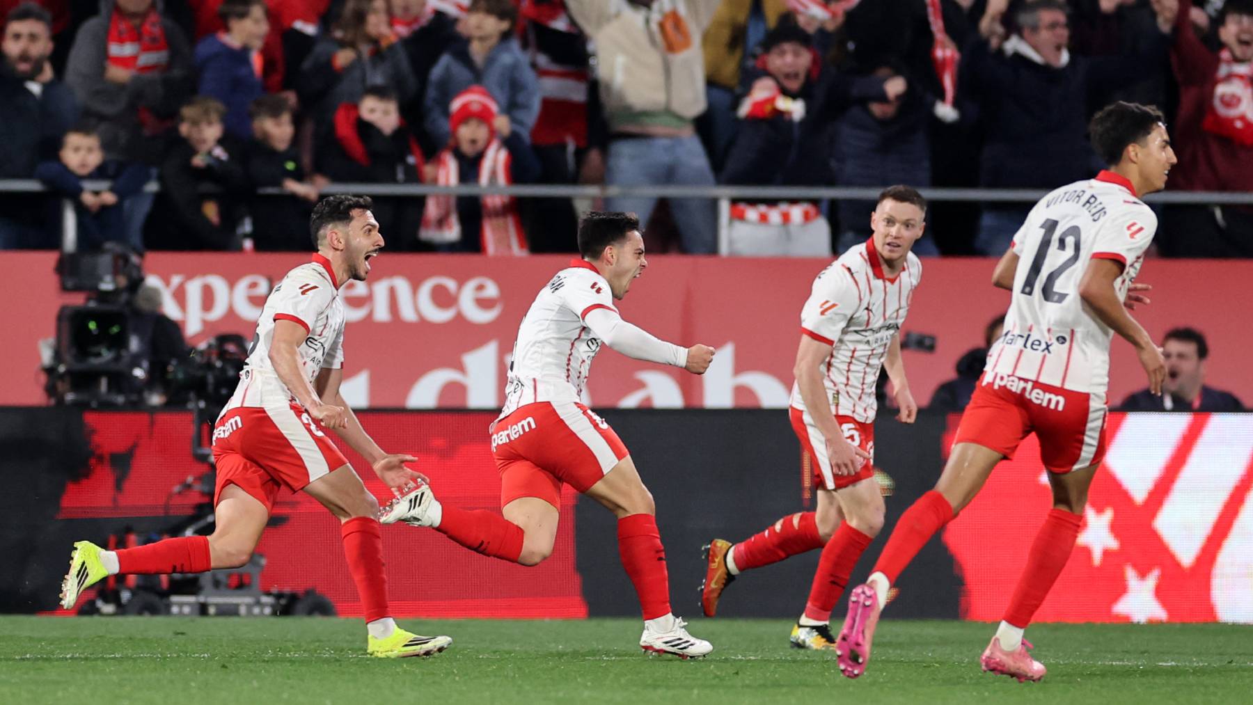 Girona's Spanish midfielder #08 Fran Beltran (C) celebrates scoring his team's second goal during the Spanish league football match between Girona FC and FC Barcelona at Montilivi Stadium in Girona on February 16, 2026.