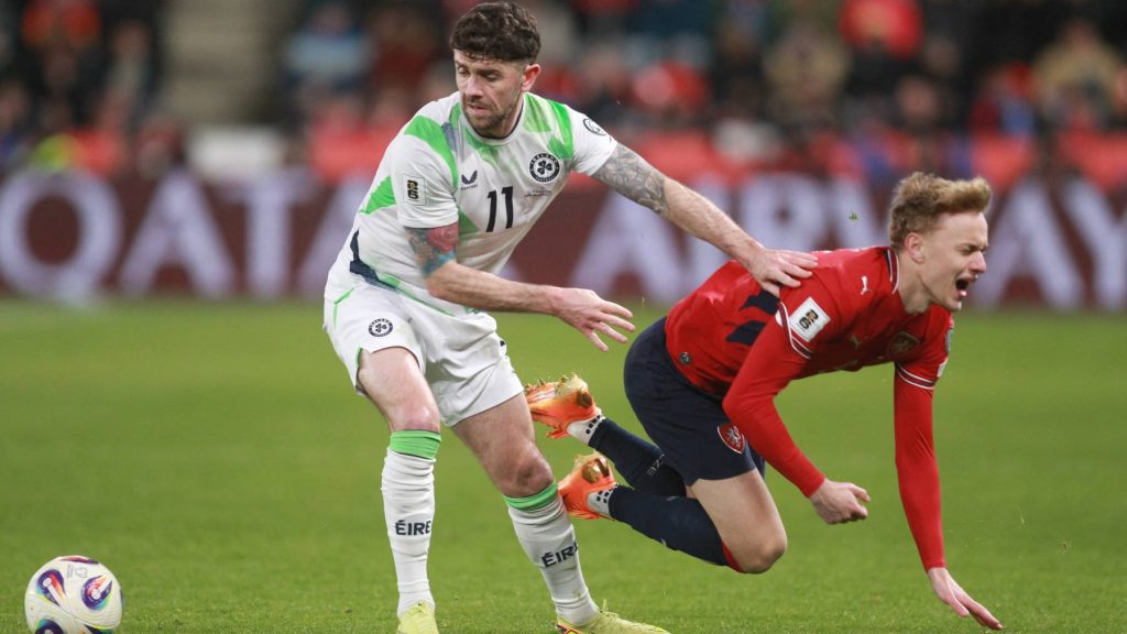 Ireland's midfielder #11 Robert Brady and Czech Republic's midfielder #09 Adam Karabec vie for the ball during the FIFA World Cup 2026 European qualification semi final football match Czech Republic vs Ireland on March 26, 2026 in Prague.