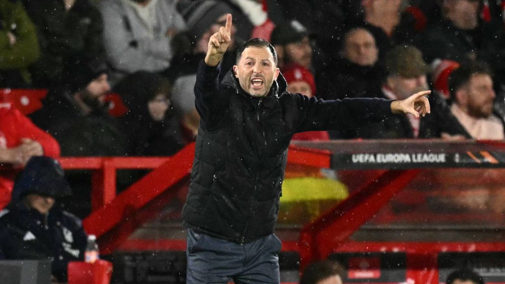 Fenerbahce's Italian-German coach Domenico Tedesco shouts instructions to the players from the touchline during the UEFA Europa League Knockout Round Play-off second-leg football match between Nottingham Forest and Fenerbahce SK at The City Ground in Nottingham, central England, on February 26, 2026.