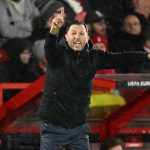 Fenerbahce's Italian-German coach Domenico Tedesco shouts instructions to the players from the touchline during the UEFA Europa League Knockout Round Play-off second-leg football match between Nottingham Forest and Fenerbahce SK at The City Ground in Nottingham, central England, on February 26, 2026.
