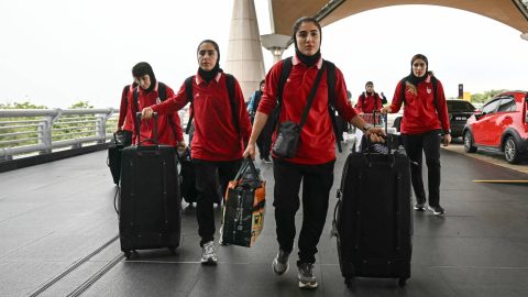 Members of Iran's women's football team arrive at the Kuala Lumpur International Airport in Sepang on March 16, 2026, after staying in a hotel in the Malaysian capital while awaiting the next leg of their journey home. Three more members of the Iranian women's football team have left their asylum in Australia and decided to return home, Canberra said on March 15.