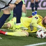 Bologna's Italian midfielder #20 Nadir Zortea (C-L) fights for the ball with Celtic's Danish goalkeeper #01 Kasper Schmeichel during the Europa League 1st round day 7 football match between Bologna and Celtic at Stadio Renato Dall'Ara in Bologna on January 22, 2026.