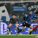 Bayern Munich's French midfielder #17 Michael Olise kicks ans scores during the UEFA Champions League last 16, first leg football match between Atalanta and Bayern Munich at the Gewiss stadium in Bergamo, on March 10, 2026.