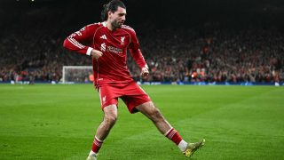 Liverpool's Hungarian midfielder #08 Dominik Szoboszlai celebrates scoring his team's first goal during the UEFA Champions League, round of 16 second leg football match between Liverpool and Galatasaray at Anfield in Liverpool, north-west England on March 18, 2026.