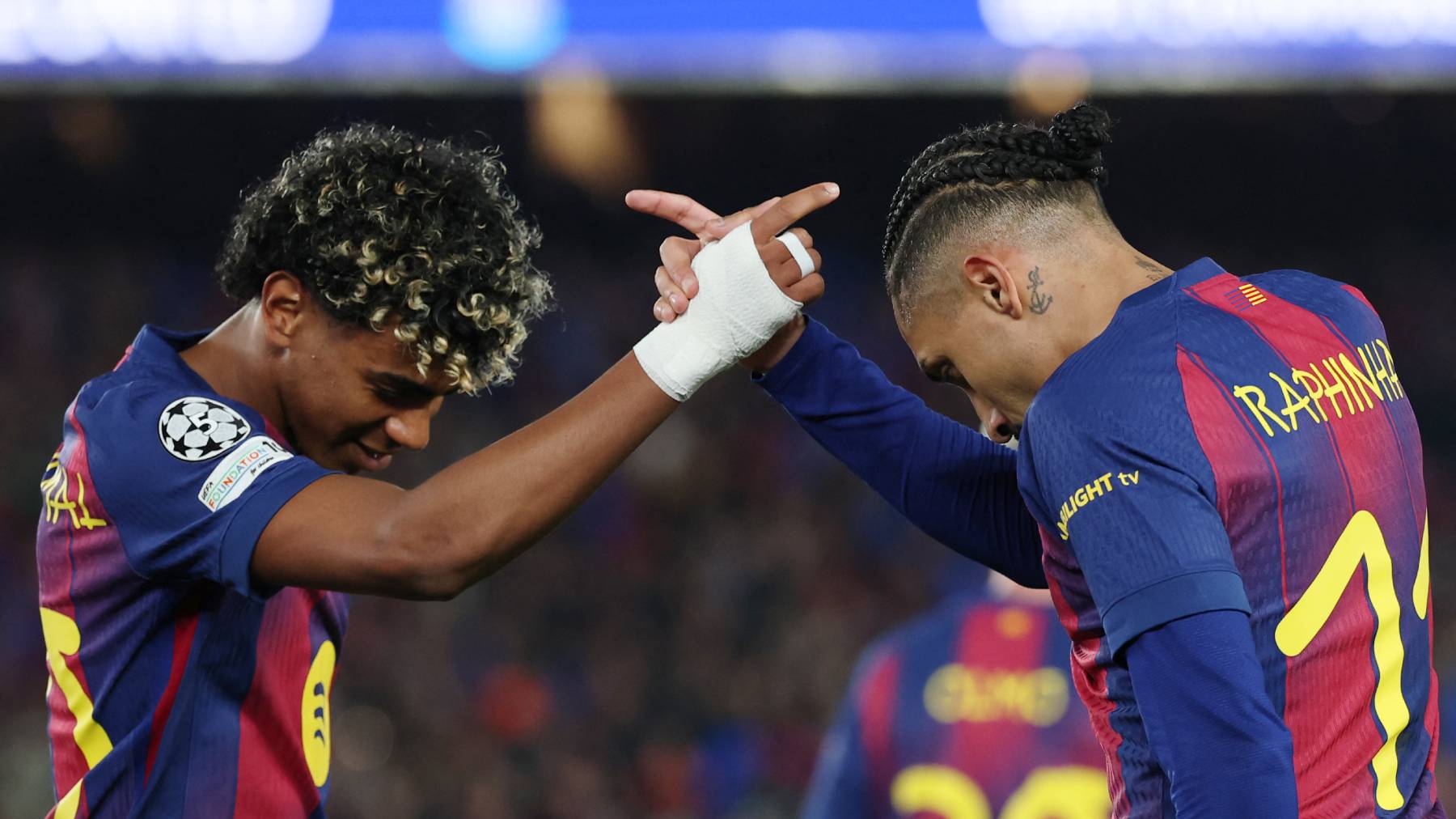 Barcelona's Brazilian forward #11 Raphinha celebrates scoring his team's seventh goal with Barcelona's Spanish forward #10 Lamine Yamal (L) during the UEFA Champions League last 16 second leg football match between FC Barcelona and Newcastle United at the Camp Nou stadium in Barcelona, on March 18, 2026.